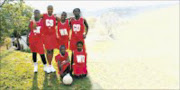 GREAT GIFT: The new uniforms and takkies that have made the Mama's Angels netball team very happy. © Sowetan.