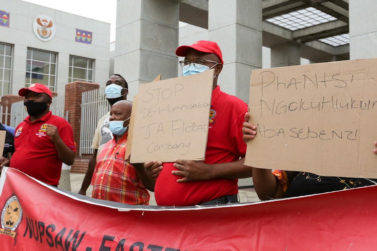 Members of the National Union of Public Service and Allied Workers (Nupsaw) protest outside the PE magistrate’s court on Wednesday to show their support for the complainants in a crimen injuria case against a former store manager.