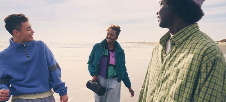 Image of a group of people sat around the SRS-XG300 X-Series Portable Wireless Speaker