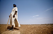 A picture released on February 20, 2012 by aid agency Oxfam shows Ahmed Di Ba, a resident of Kaedi, in the drought stricken South of Mauritania, telling he is unable to find any pasture for his cows.