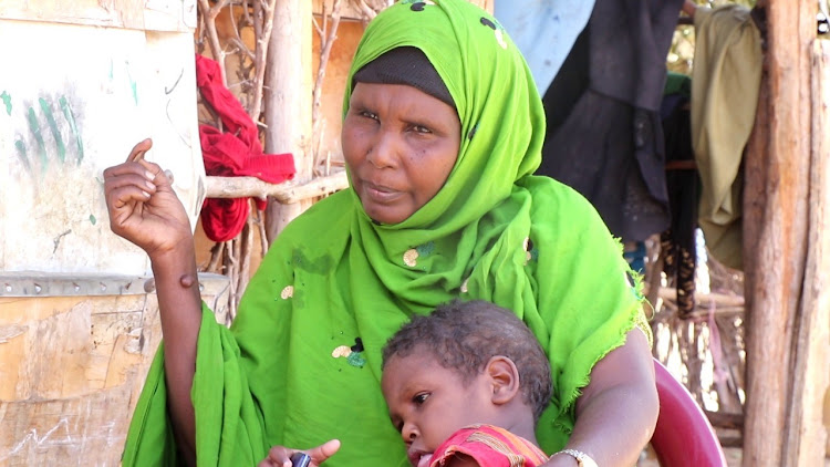 Ambia Hassan with her five-year-old grand-daughter at the Sankuri dispensary.