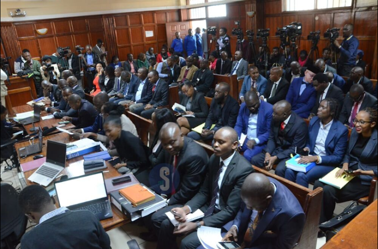 Fully packed court awaiting the three-judge bench for the ruling of a petition challenging appointment 50 CAS by President William Ruto at Milimani Law Court on July 3, 2023.