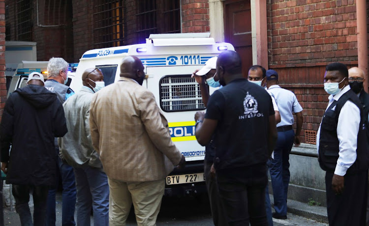 Alleged leaders of the Nigerian syndicate Black Axe arrive at the Cape Town magistrate's court after their arrest last week. File photo.