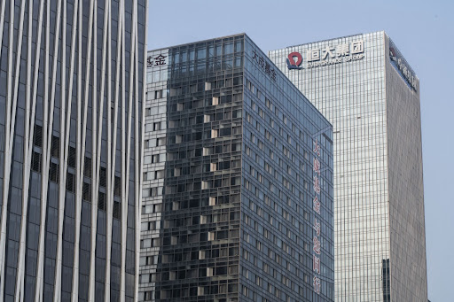 The China Evergrande Group logo displayed atop the company's headquarters, right, in Shenzhen, China, on Thursday September 30 2021.