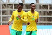 Luvuyo Mkatshana of South Africa (l) celebrates goal with teammate Sbusiso Mabiliso of South Africa (r) during the 2017 COSAFA U20 semi-final football match between South Africa and Egypt at Arthur Davies Stadium, Kitwe on 14 December 2017.