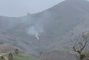 Smoke rises amid foggy weather from the site of a helicopter crash that killed former NBA star Kobe Bryant, his daughter Gianna and seven others, along a hillside in Calabasas, California, U.S., January 26, 2020, in this photo obtained via social media