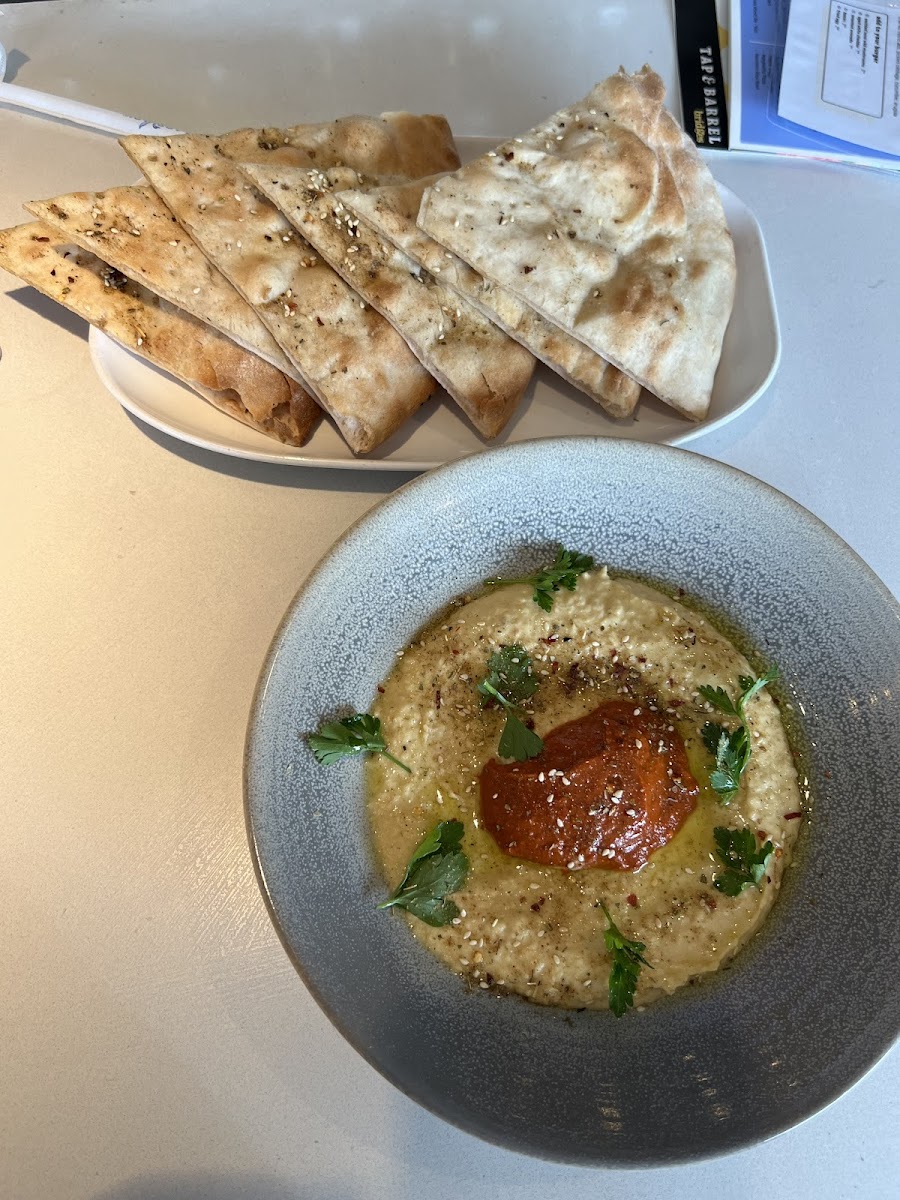 Hummus with no whipped feta, and gluten free flatbread. If you want you can also ask for cumin dusted tortilla chips but they are fried in the same fryer as the rest.