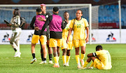 Nigerian players console dejected opponents Banyana Banyana after the Super Falcons won their Caf Women's Olympic final-round qualifier 1-0 on aggregate with a 0-0 second leg draw at Loftus on Tuesday.