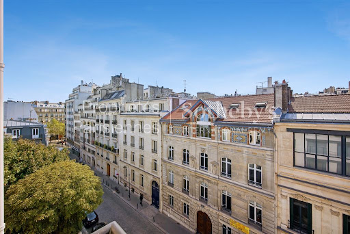 Street view Haussmannian buildings blue sky in this luxury property for sale in Paris 16ème ($1,860,429 - 88 m²)