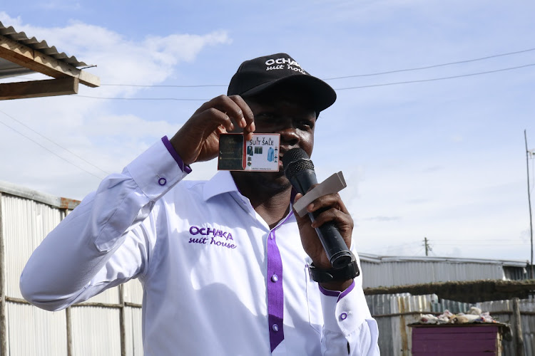 Ochaka Suits House Ltd CEO Harrison Ochaka displaying his products at Nuru children home in Athi River, Machakos County on May 13, 2024.