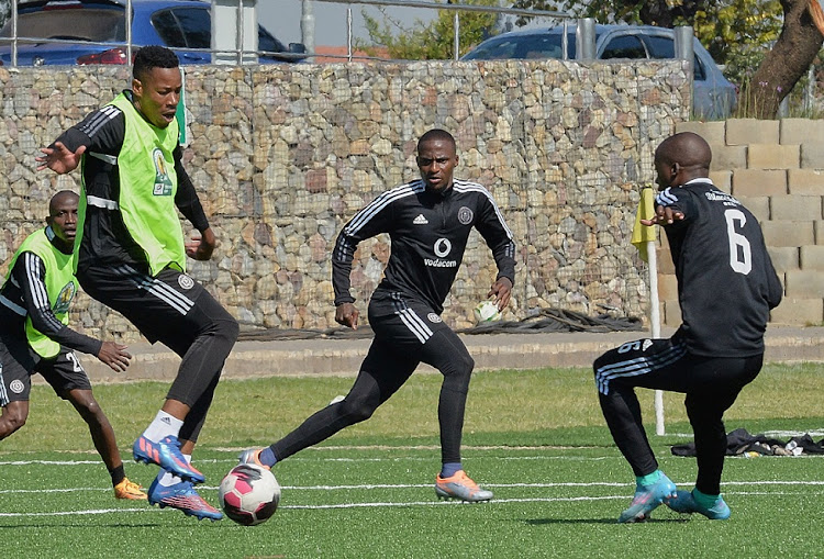 Orlando Pirates captain Happy Jele and teammates Thembinkosi Lorch and Ben Motshwari train ahead of their Caf Confederation Cup semifinal first leg match against Al Ahli Tripoli.