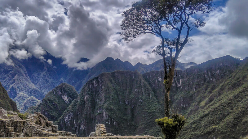 exploring Machu Picchu citadel near cusco+andes+mountains+peru