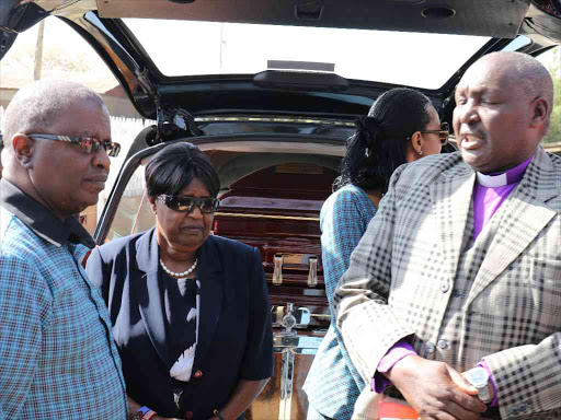Former Heritage minster William ole Ntimama’s son Amos, wife Dorcas and a relative when the coffi n of the Maasai icon arrived at their Motonyi home in Narok town on September 14 /KIPLANG’AT KIRUI