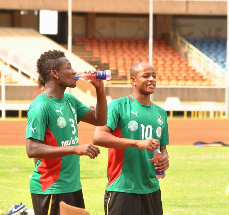 Dede Andre Ayew with Asamoah Gyan in past training