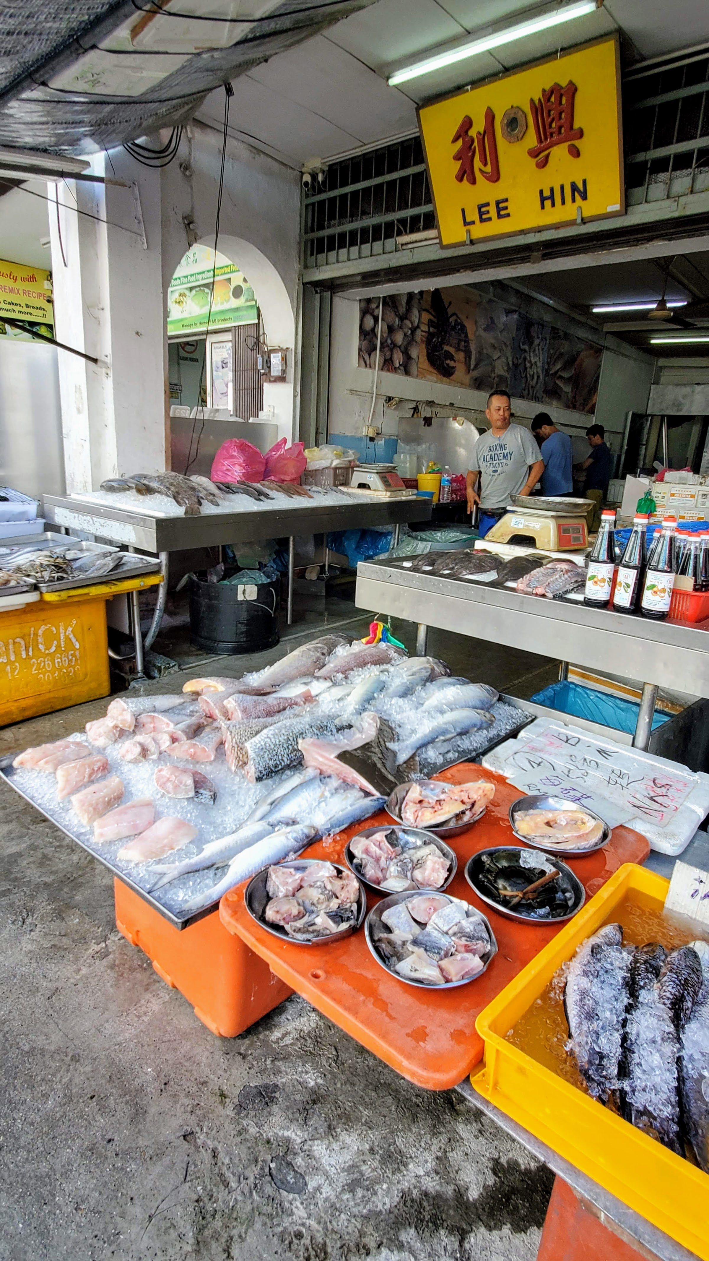 Tips on visiting George Town: sometimes the five foot walkways are clear for walking, sometimes you may have to detour into the street because there are no sidewalks and the five foot way is being used for motorcycle parking or as extensions of the shop