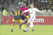 MAKING MOVES:  Willard Katsande and Matthew Pattison   during the 
       Premiership match between Wits and Kaizer Chiefs at Mbombela Stadium  in Nelspruit last night. Pattison scored the Clever Boys' only goal. 
    
      Photo: Gallo Images