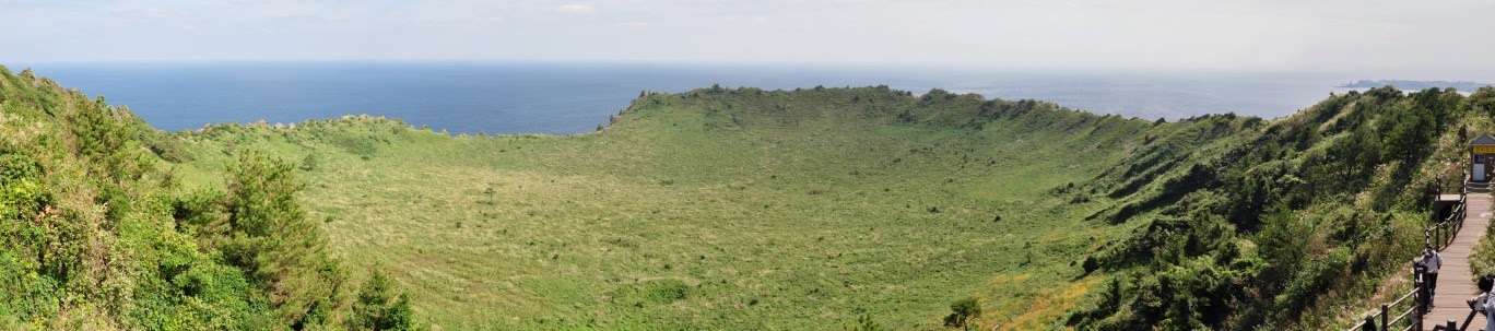 Panoramic view of the grass covered crater at the top of Seongsan Ilchulbong. 