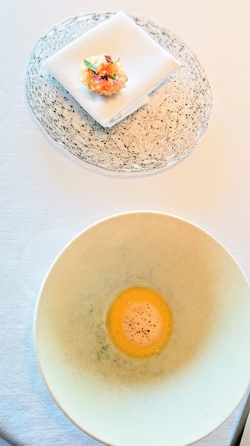 Course of Dried and Creamy Trout and Juice from Fermented and Grilled Cauliflower at Geranium, a three Michelin star restaurant in Copenhagen