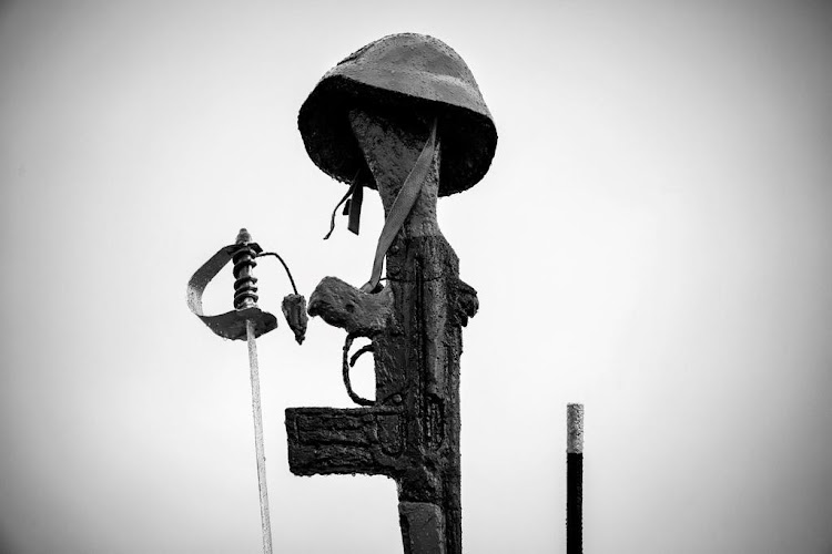 A statue of a sword, cap and gun at the monument for honoring those who died in line of duty in the past year.