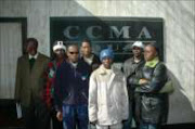 RECOURSE: Aggrieved employees Joe Mthimkulu, Paulos Diphoko, Justice Hlahla, Edward Williams, Joel Phohleli, Albert Ngulube and Thoko Mdaweni at the CCMA. Pic. Mabuti Kali. 03/07/07. © Sunday World.