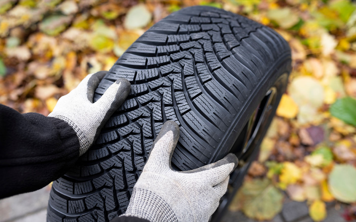 holding a car tyre