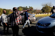 A group of Uber and Taxify drivers protesting on Jan Smuts Avenue in Johannesburg on June 18 2018. The drivers are protesting against their fares remaining the same despite the recent sharp hike in the petrol price and a VAT increase. 