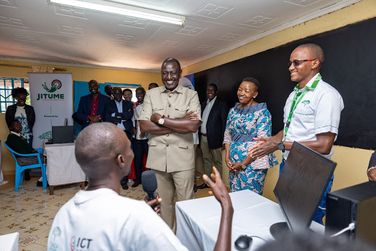 President William Ruto and First Lady Rachel Ruto interact with Abraham Leteipa Kaeno, a young beneficiary of the Konza Digital Skills in Narok on March 17, 2024