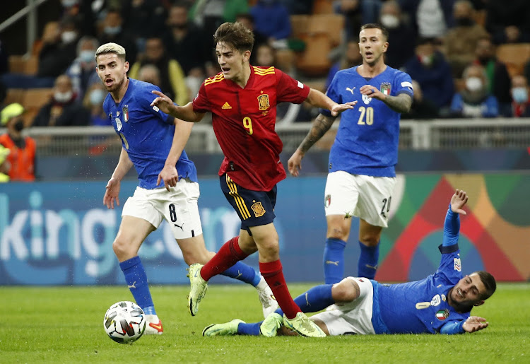 Spain's Gavi in action with Italy's Jorginho and Marco Verratti