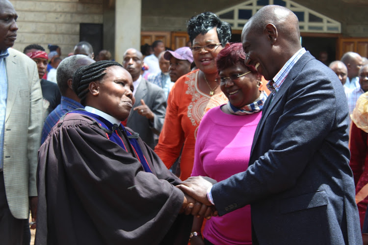 Deputy President William Ruto (R ) with MPs and church leaders outside Icuga PCEA church in Mathira on Sunday