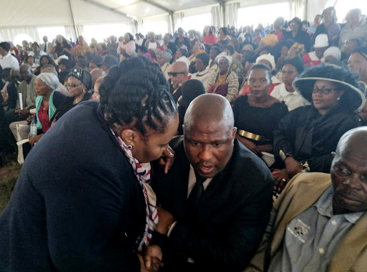 Transport MEC Weziwe Tikana-Gxothiwe speaks to Premier Oscar Mabuyane during a mass funeral