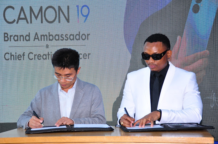 Tecno Mobile Kenya brand Manager Peter Shi and Otile Brown