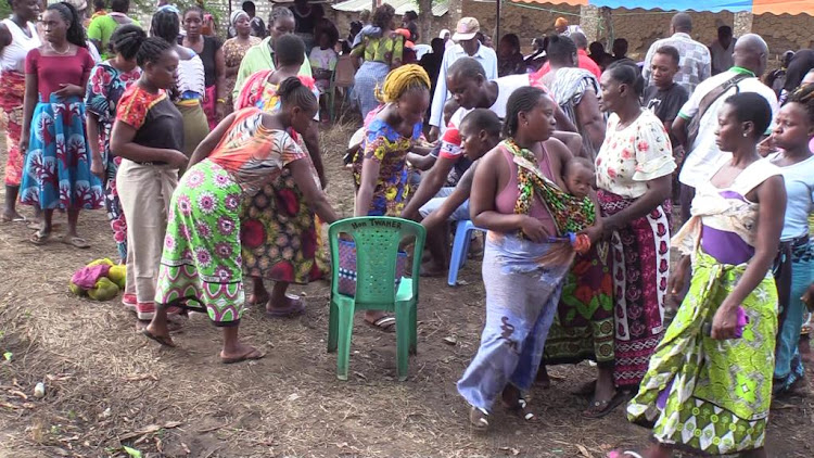 Mourners contribute during a fundraising for the burial of Shakahola family members who perished in Shakahola forest.