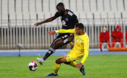 Deon Hotto of Orlando Pirates escapes a challenge from a JS Saoura player in their CAF Confederation Cup match.