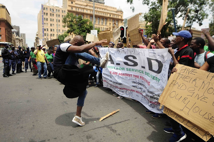 Residents of Dayveton in Ekurhuleni and members of Activist for Service Delivery picketed outside the Gauteng Provincial Legislature in Johannesburg during the State of the Province Address by premier David Makhura demanding houses.