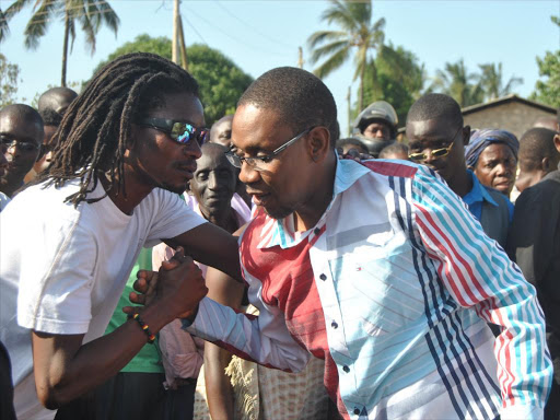 KARIBU: Malindi ODM Canidate Willy Mtengo (centre) greets supporters on arrival at a rally in Kwa Chocha, Shella wward, on Friday .