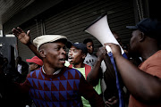 Members of the African Security Congress protest outside the premises of the Private Security Industry Regulatory Authority. 