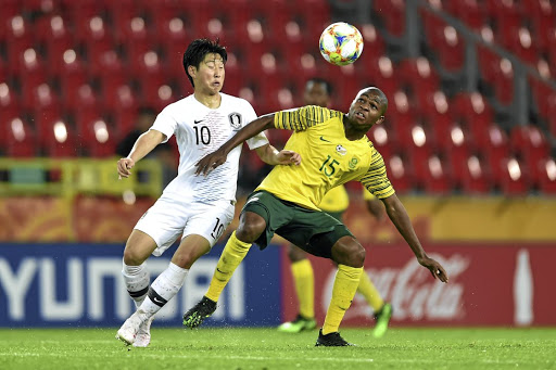 Siphesihle Mkhize of SA battles for possession with Kangin Lee of Korea Republic in their Fifa U20 World Cup group match on Tuesday.