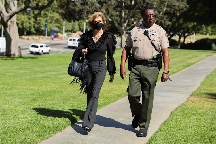 Plaintiff Judy Huth arrives with the sheriff's deputy for opening statements in the civil suit against Bill Cosby at the Santa Monica courthouse, California.