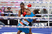 Mellissa 'Honey Bee' Miller and Sharradene Fortuin exchange leather during their fight which Fortuin controversially won.