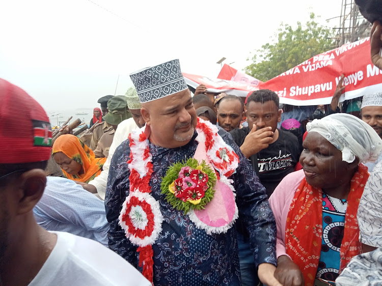 Lamu Governor Fahim Twaha with supporters shortly after he was cleared by IEBC to defend his seat in the August 9 elections