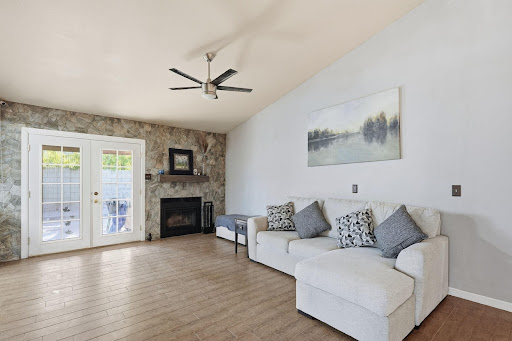 Modern living room with fireplace and white sofa - Prestige property for sale in Scottsdale, 3 bedrooms