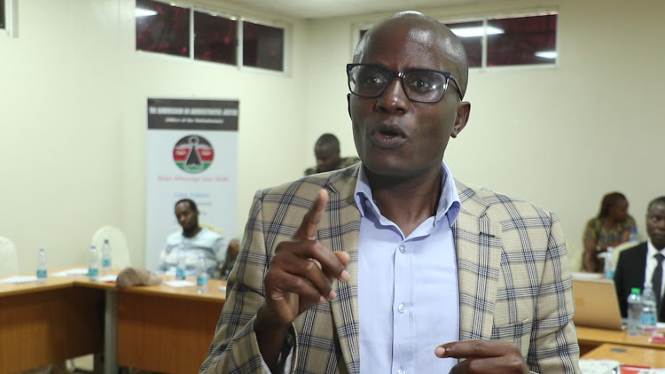 Vice chairperson of the Commission of Administrative Justice Washington Opiyo Sati addressing the press at a Garissa hotel during a stakeholders meeting on the Financing Locally-Led Climate Action Program (FLLoCA).