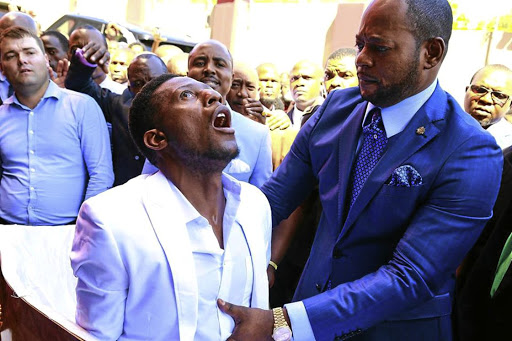 Alleluia International Ministries pastor Alph Lukau 'resurrects' Brighton 'Elliot' Moyo, who was already in his coffin.