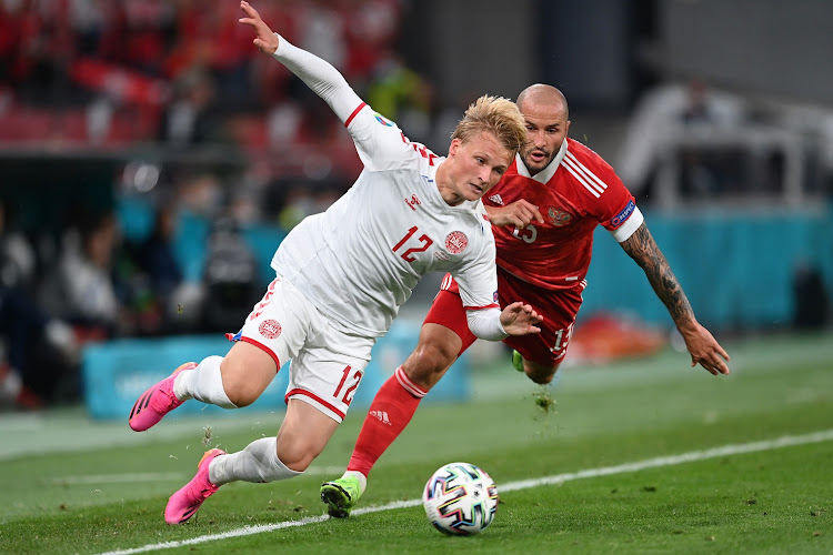 Kasper Dolberg of Denmark is fouled by Fedor Kudryashov of Russia in the Uefa Euro 2020 Championship Group B match at Parken Stadium in Copenhagen, Denmark on June 21, 2021.