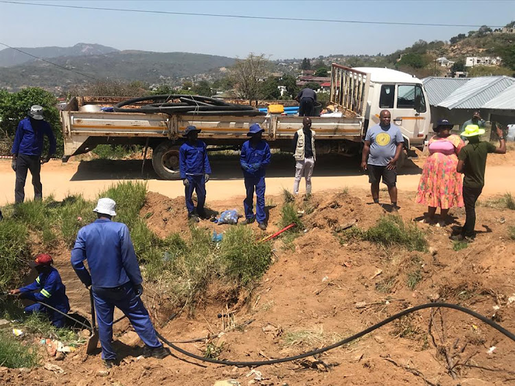 Mbombela mayor Sibongile Mazibuko-Makhushe (in pink) monitoring the removal of illegal connections at KaBokweni on Wednesday.