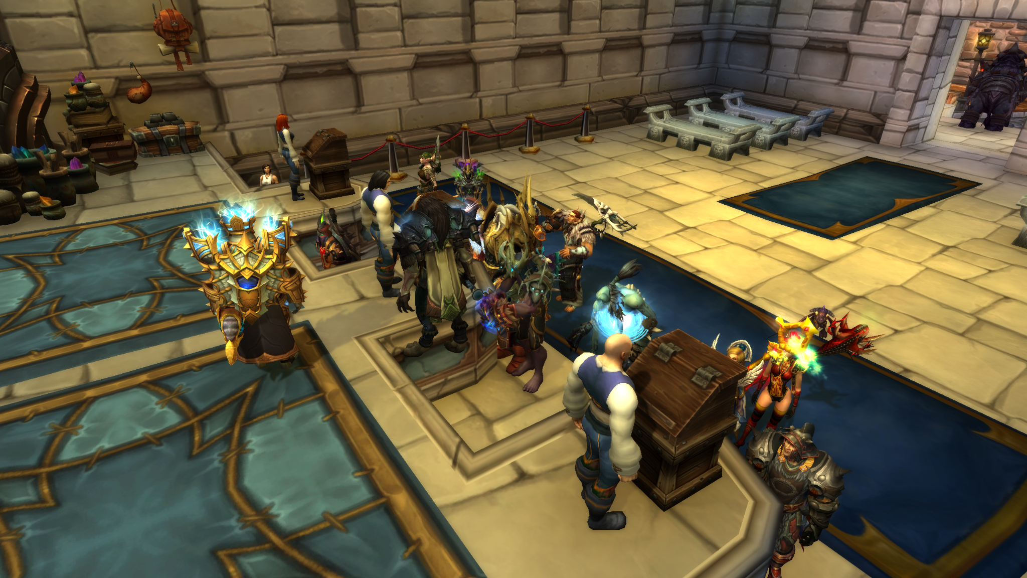 An image of the Stormwind auction house on the Sargeras Realm in World of Warcraft. You can see multiple players interacting with the economy and some just dancing with each other.