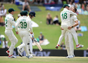 South Africa captain Faf du Plessis congratulates bowler Dwaine Pretorius after he dismissed England batsmen Joe Denly during day four of the first Test at SuperSport Park on December 29 2019 in Pretoria, South Africa. 