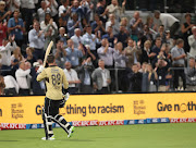 Devon Conway signals to the crowd as he leaves the field for an unbeaten 99.