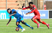 Puleng Tlolane of Polokwane City and Luckyboy Mokoena of Highlands Park during the Absa Premiership match between Highlands Park and Polokwane City at Makhulong Stadium on September 29 2019 in Johannesburg. 