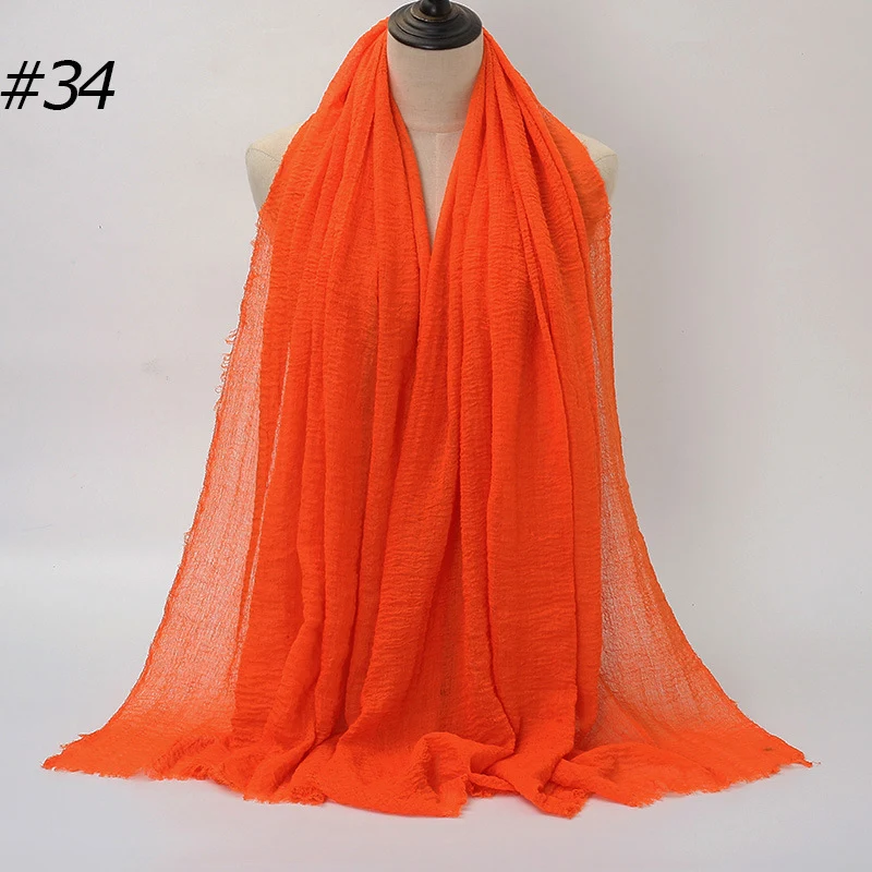 Écharpe châle longue froissée unie pour femme avec franges, style Malaisie. Élégance et confort pour un look tendance et chaud, parfait en toutes saisons.